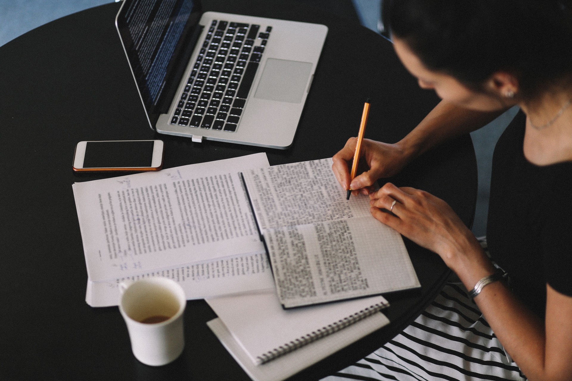 Woman reading and working at home